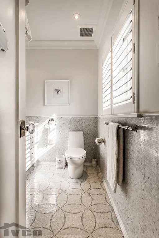 a bathroom with gray tiles